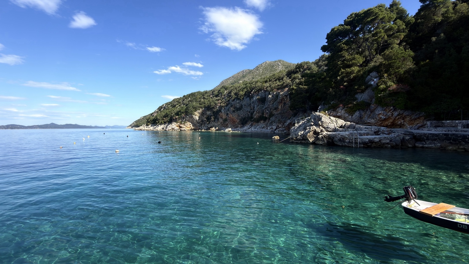 A quiet rocky cove with exceptionally clear green-blue water near Dubrovnik